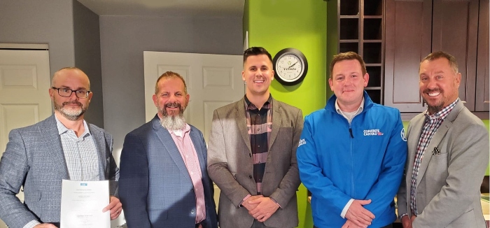 Executives of Concrete Canvas and Titan Environmental Containment after the signing of new distribution agreement.